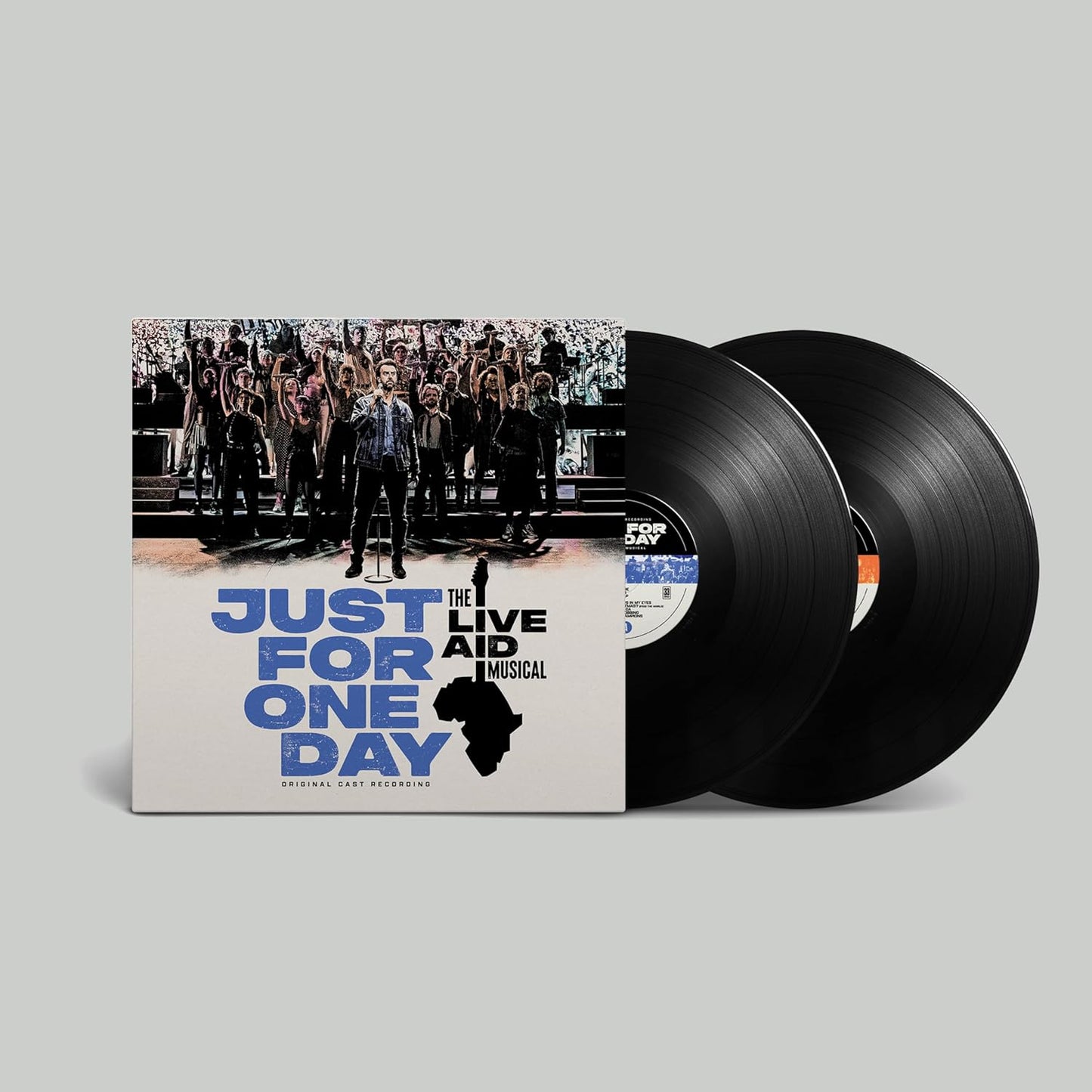 Vinyl records with a cover featuring 'Just For One Day' from The Live Aid Musical on a gray background.