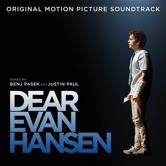 Cover art for the 'Dear Evan Hansen' original motion picture soundtrack featuring a male character in a grey shirt and khaki pants, with a dark background. The soundtrack is on blue vinyl and includes tracks by Benj Pasek and Justin Paul.
