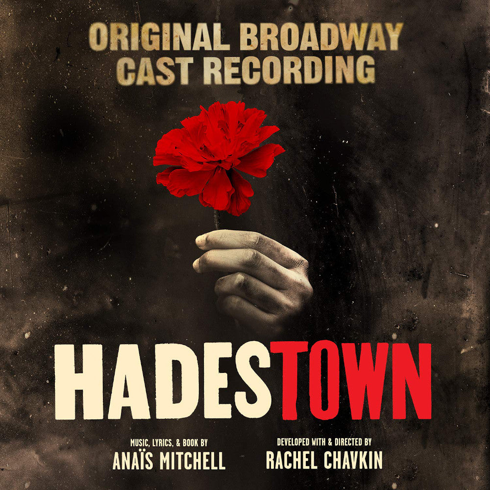 Cover art for Hadestown (Original Broadway Cast Recording) album with a hand holding a red flower, against a black background with text detailing the title and other information.