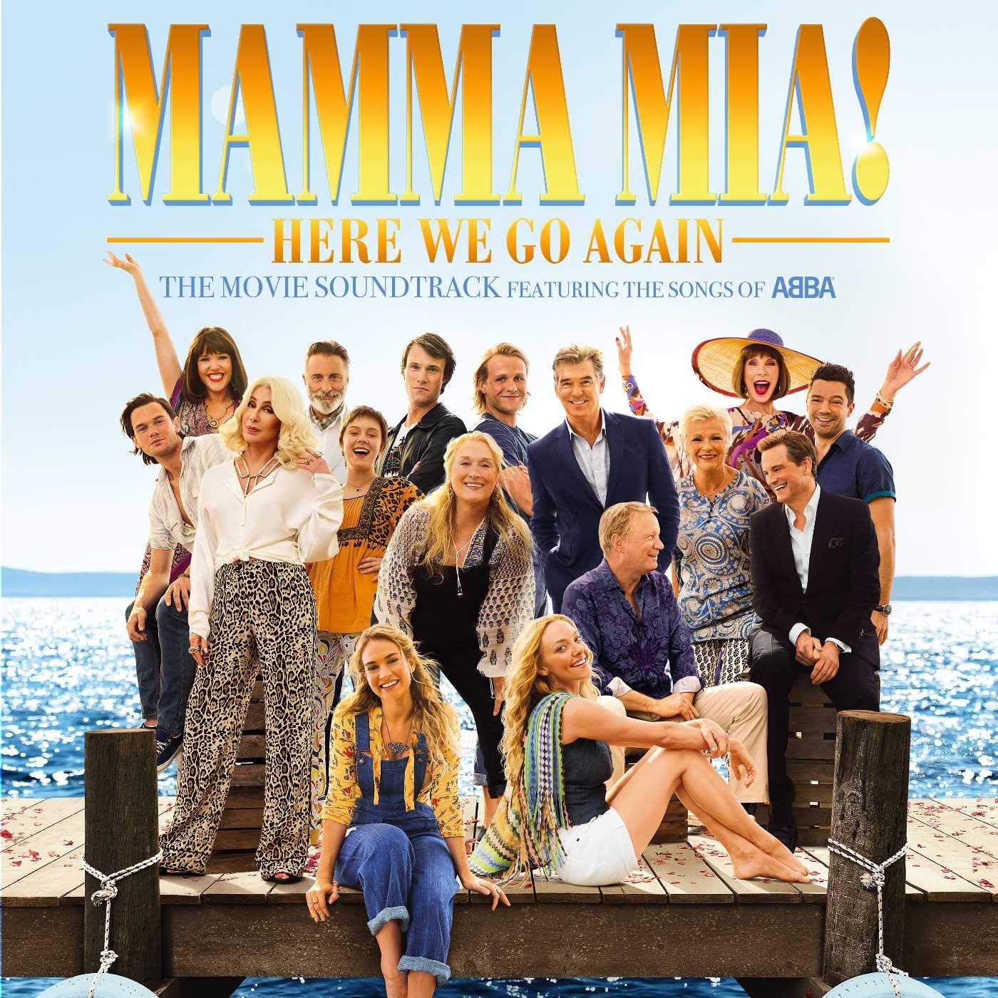 Cover of the 'Mamma Mia! Here We Go Again' soundtrack album featuring a group photo of the movie's cast on a boat, with the ocean and sky in the background.