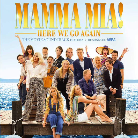 Cover of the 'Mamma Mia! Here We Go Again' soundtrack album featuring a group photo of the movie's cast on a boat, with the ocean and sky in the background.